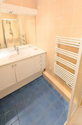 a bathroom with a sink and a mirror at Ref FLORIAN by Palmes dProperties in Cannes