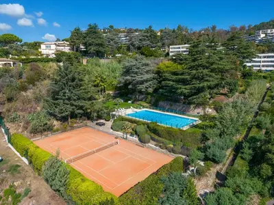 an overhead view of a tennis court with a tennis at Riviera Escape – Sea View, Pool & Tennis in Cannes