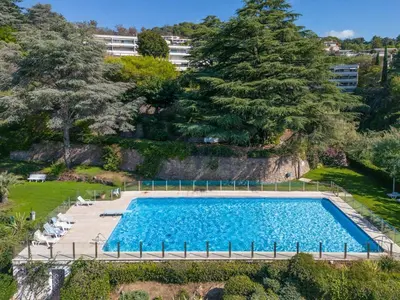 an overhead view of a large swimming pool with trees at Riviera Escape – Sea View, Pool & Tennis in Cannes