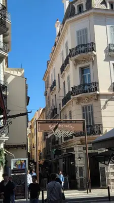 a set of stairs in an alley between two buildings at Studio F1 avec jardin, proche du Palais des festivals et des plages in Cannes