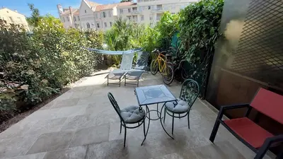 a kitchen with a sink and a counter top at Studio F1 avec jardin, proche du Palais des festivals et des plages in Cannes