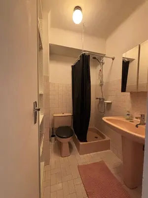 a bathroom with a toilet and a sink at Studio au California Palace in Cannes