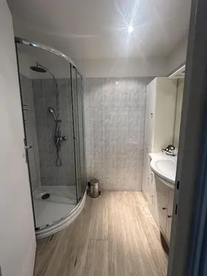 a bathroom with a shower and a sink at Abou1895 in Cannes