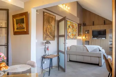 a living room with a couch and a table at Apartment Cannes Felibriges in Cannes