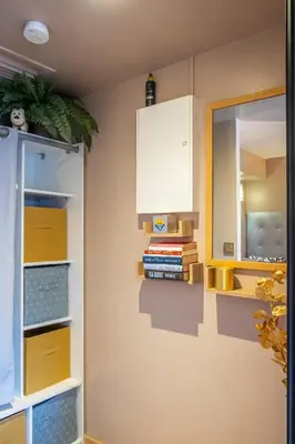 a kitchen with yellow cabinets and a mirror at Apartment Cannes Felibriges in Cannes