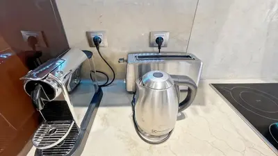 a kitchen with a mixer and a toaster on a counter at Luxurious 3-Bedroom Apartment in Heart of Cannes in Cannes