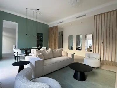 a living room with a couch and chairs and a table at Appartement Centre Cannes in Cannes