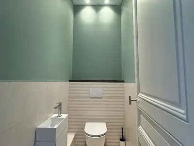 a bathroom with a toilet and a sink at Appartement Centre Cannes in Cannes