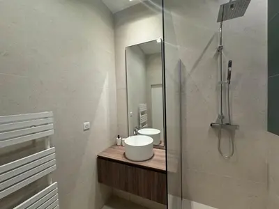 a bathroom with a sink and a mirror at Appartement Centre Cannes in Cannes