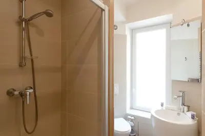 a bathroom with a shower and a toilet and a sink at Le Cosy YourHostHelper in Cannes