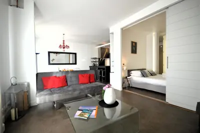 a living room with a couch and a bed at 