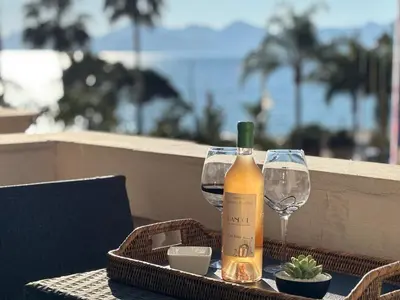 a bottle of wine and two glasses on a table at 