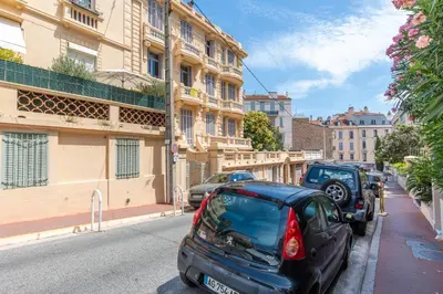 a group of cars parked on the side of a street at Pelige 3 YourHostHelper in Cannes