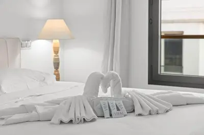 a person laying on a bed with towels at Cannes Croisette 2 bedrooms - 7C3 in Cannes