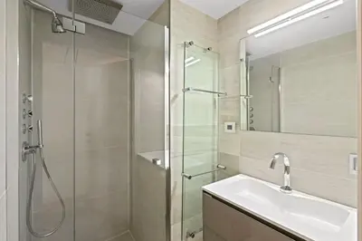 a bathroom with a glass shower and a sink at Cannes Croisette 2 bedrooms - 7C3 in Cannes