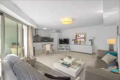 a living room with a couch and a table at Cannes Croisette 2 bedrooms - 7C3 in Cannes