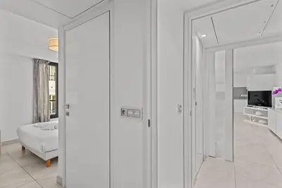 a white room with a sliding glass door at Cannes Croisette 2 bedrooms - 7C3 in Cannes