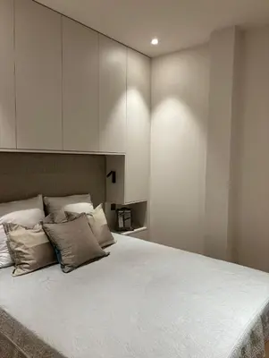 a bedroom with a large bed with white cabinets at Cannes 1 bedroom apartment - M1 in Cannes