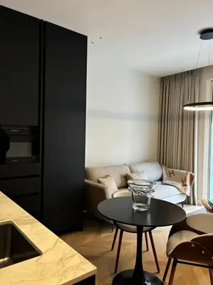 a living room with a couch and a table at Cannes 1 bedroom apartment - M1 in Cannes