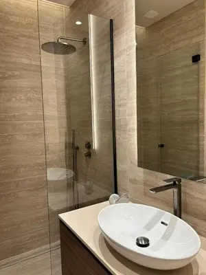 a bathroom with a white sink and a shower at Cannes 1 bedroom apartment - M1 in Cannes