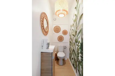 a bathroom with a toilet and a sink at Immogroom - Warm T2 - AC - Wifi - Comfort in Cannes