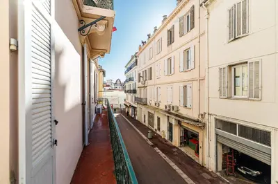 an empty street in an alley between buildings at L'Escapade Cannoise Forville in Cannes
