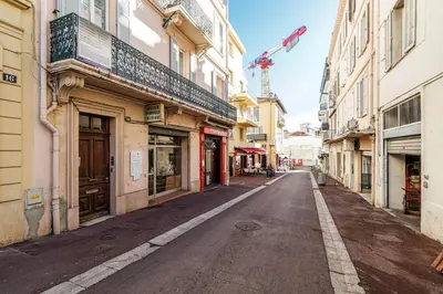 an empty street in a city with buildings at L'Escapade Cannoise Forville in Cannes