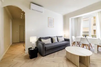 a living room with a couch and a table at Cannes banana apartment in Cannes