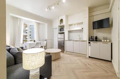 a living room with a couch and a table at Cannes banana apartment in Cannes