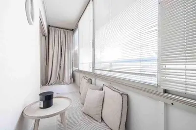 a living room with a table and a window at Pasteur Luxury apartment la Croisette in Cannes