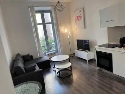 a living room with a couch and a table at Villa Mimosa - Cannes in Cannes
