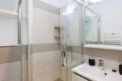 a bathroom with a shower and a sink at Villa Mimosa - Cannes in Cannes
