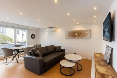 a living room with a couch and a table at La Suite du Festival in Cannes