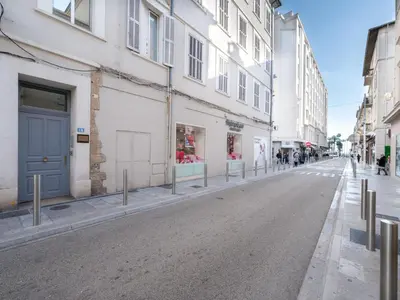 an empty street in a city with buildings at Apartment rue des Serbes by Interhome in Cannes