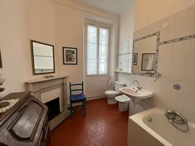 a bathroom with a sink toilet and a fireplace at A005 Spacious and bright apt close to Croisette in Cannes
