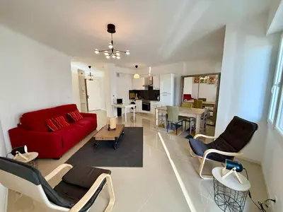 a bathroom with a white tub and a toilet at C083 Croisette - 1 chambre - Vue Epoustouflante in Cannes