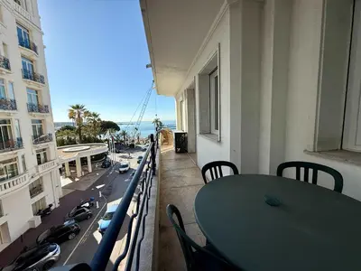 a white bedroom with a large bed and a window at C083 Croisette - 1 chambre - Vue Epoustouflante in Cannes