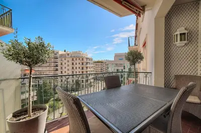 a table and chairs on a balcony with a view at REF 1482 - Cannes Back Croisette - Apartment for rent in Cannes