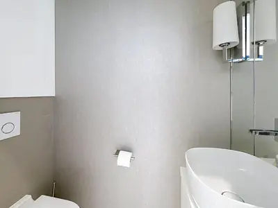a living room with white furniture and a flat screen tv at Penthouse 2-Bedroom apartment with 360º views and parking in Cannes