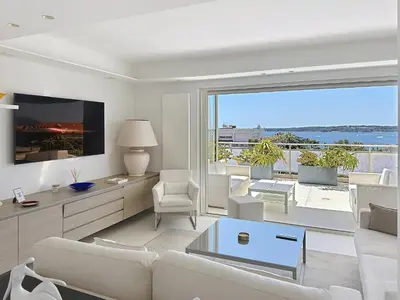 a white kitchen with a sink and a window at Penthouse 2-Bedroom apartment with 360º views and parking in Cannes