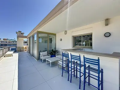 an apartment with a living room with a gym at Penthouse 2-Bedroom apartment with 360º views and parking in Cannes