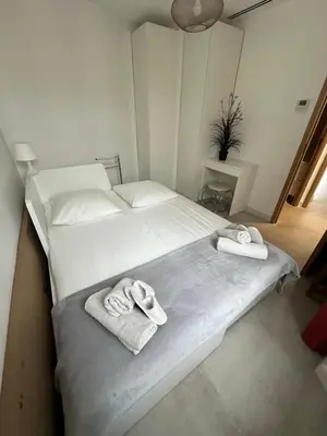 a bedroom with two towels on a bed at Maison 4pièces -Haut Standing CANNES in Cannes