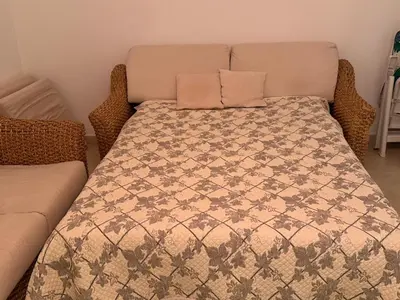 a bed with a pillow on top of it at Very bright T2 near beach in Cannes