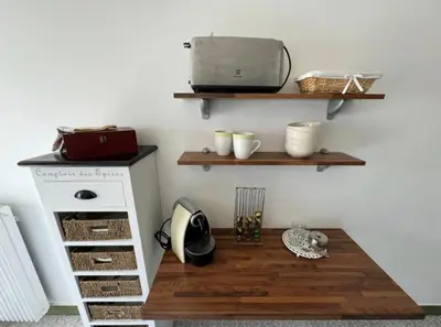 a room with a table and a laptop on a wall at Cozy one bedroom apartment with balcony and parking in Cannes