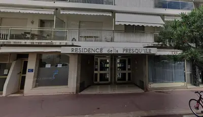 a building with a sign that reads residence cell preserve at Cozy one bedroom apartment with balcony and parking in Cannes