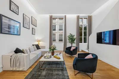 a white living room with a couch and chairs at Jessicannes Hoche 4 min Palais Festival & Beaches in Cannes