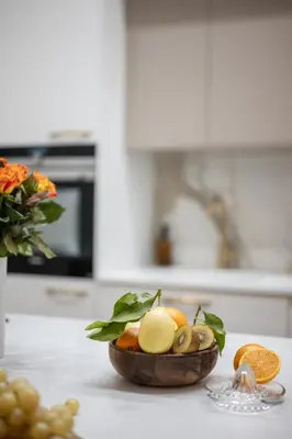 a bowl of fruit on a counter in a kitchen at Jessicannes Hoche 4 min Palais Festival & Beaches in Cannes