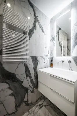 a bathroom with a white sink and a mirror at Jessicannes Hoche 4 min Palais Festival & Beaches in Cannes