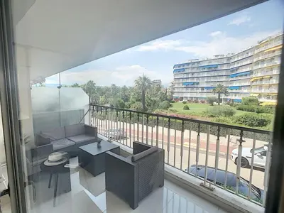 a balcony with a view of a large building at Studio apartment on La Croisette with terrace in Cannes