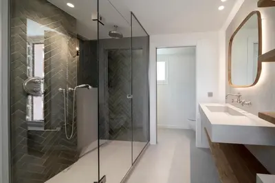 a bathroom with a glass shower and a sink at REF 1923 - Cannes Vieux-Port 5-star penthouse for rent sea view in Cannes